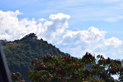 Scenic view of tree mountains against sky