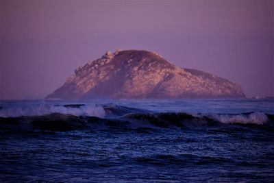 Scenic view of sea against clear sky during sunset