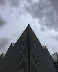 Low angle view of building against cloudy sky