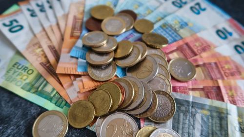 High angle view of coins on table
