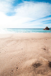 Scenic view of beach against sky