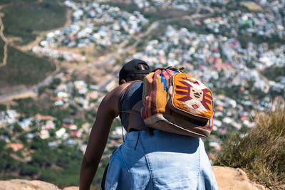 Rear view of woman with backpack