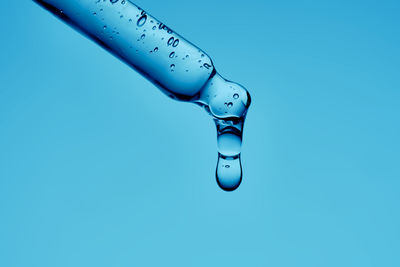 Low angle view of dental equipment against blue background