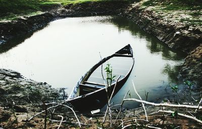 High angle view of abandoned boat moored in lake
