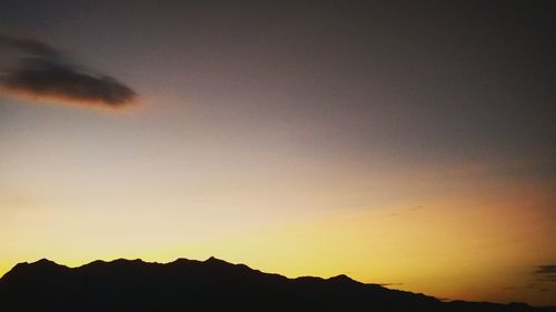 Low angle view of silhouette mountain against sky