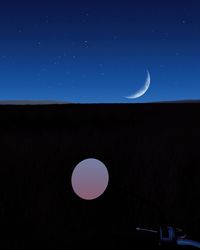 Scenic view of moon against sky at night