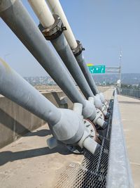 Low angle view of industry against sky