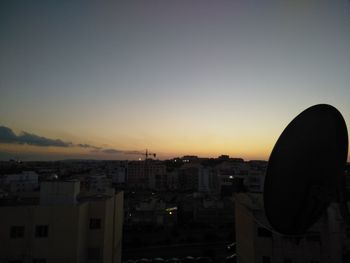 Cityscape against sky during sunset