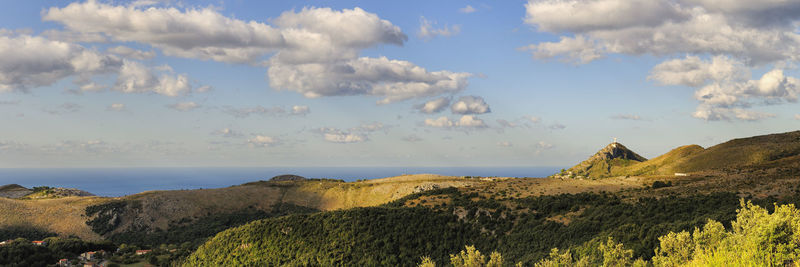 Scenic view of sea against cloudy sky