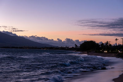 Scenic view of beach against sky during sunset