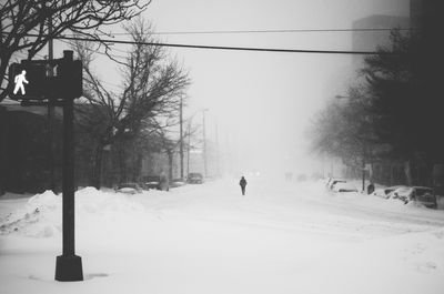 Road passing through snow covered landscape