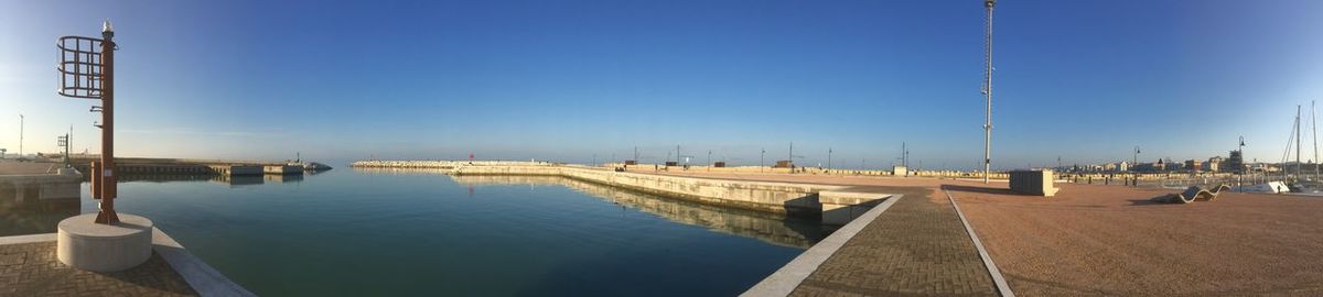 Panoramic view of beach against clear sky