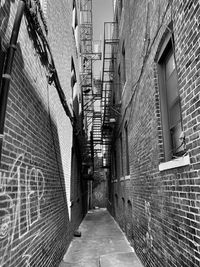 Narrow alley amidst buildings in city