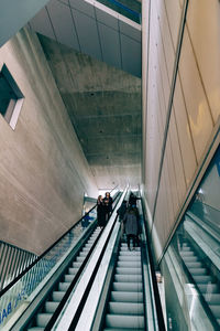 Rear view of people on escalator