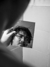 Portrait of young man in bathroom at home