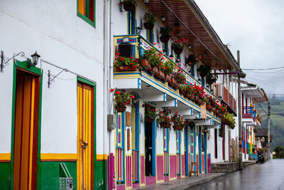 Beautiful traditional wooden balcony in colombia decorated with flowering plants in salento