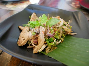 Close-up of leaves in plate on table