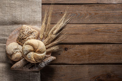 Close-up of snail on wooden table