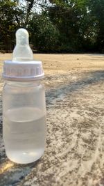 Close-up of glass bottle on table