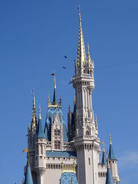 Low angle view of building against blue sky