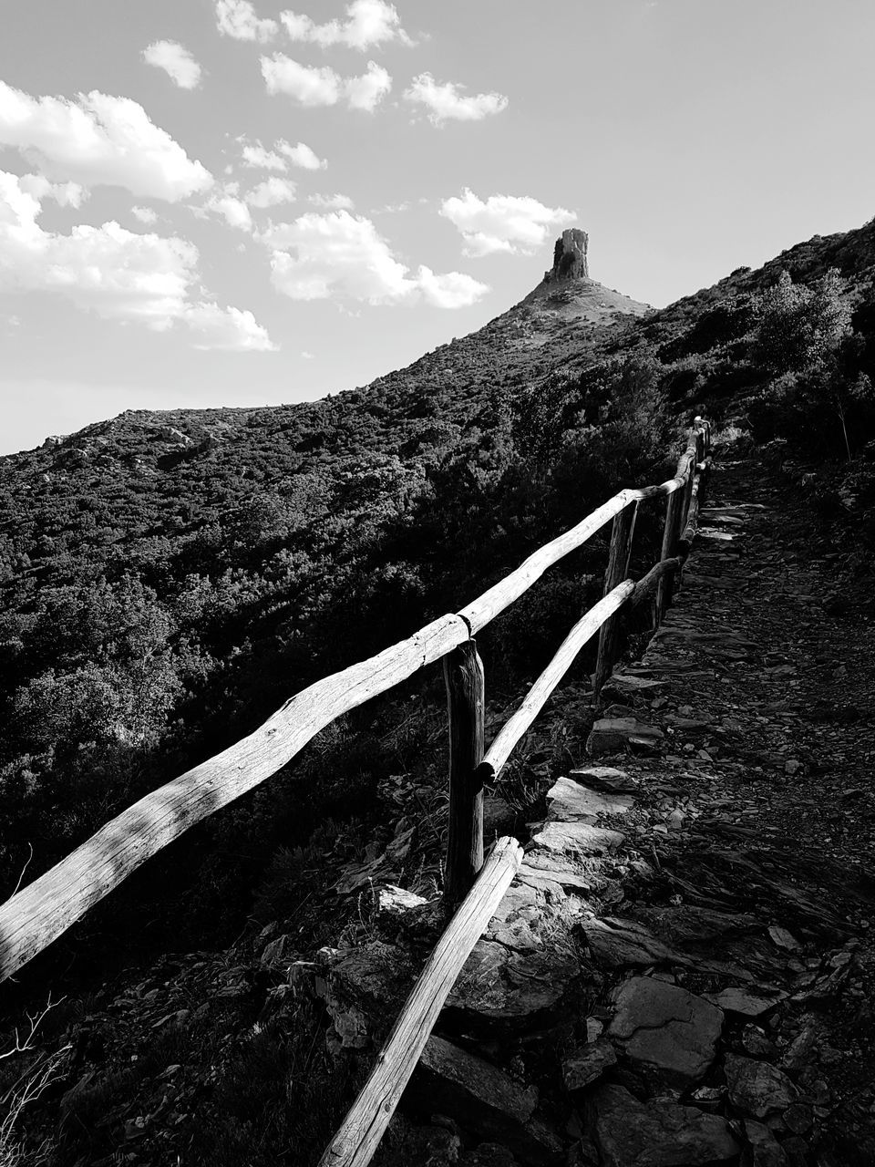 mountain, tranquil scene, tranquility, scenics, non-urban scene, nature, sky, the way forward, landscape, day, beauty in nature, mountain range, winding road, outdoors, no people, low angle view, physical geography, road, mountain road