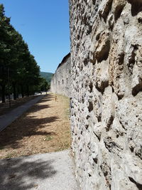 View of stone wall against clear sky
