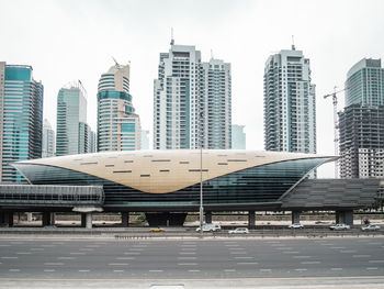 Modern buildings in city against sky