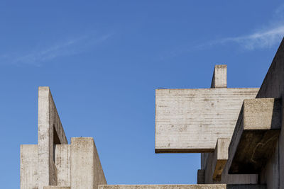 Low angle view of old building against blue sky