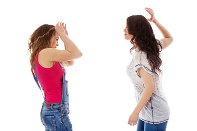 Woman standing against white background
