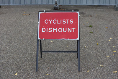 High angle view of road sign on street