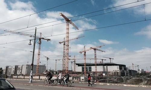 Construction site in city against sky