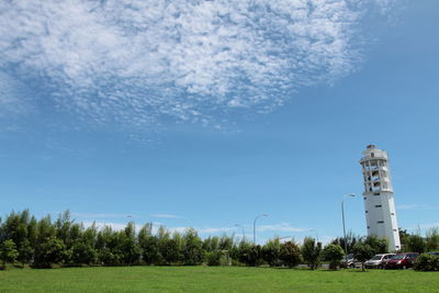 Scenery of cloudy blue sky with the manado city lighthouse on right side