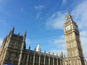 Low angle view of clock tower against sky