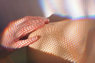 Close-up of woman hand on skin