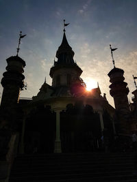 Low angle view of building against sky during sunset