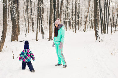 Full length of woman on field during winter