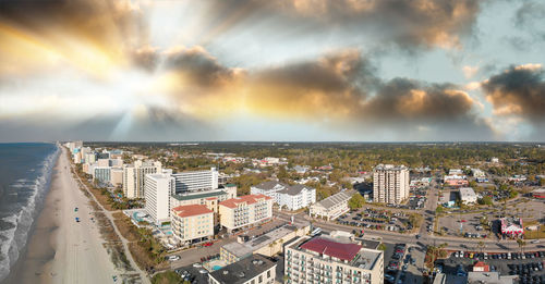 High angle view of buildings against sky during sunset