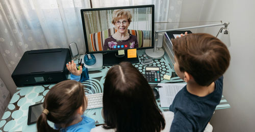 High angle view of family on video call