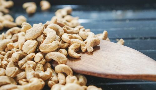 Close-up of roasted coffee beans on table