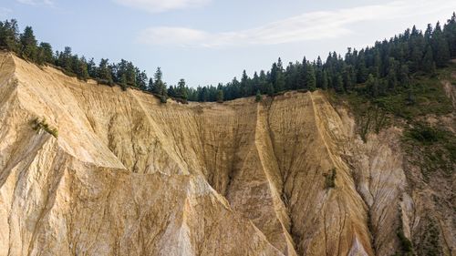 Panoramic view of arid landscape against sky