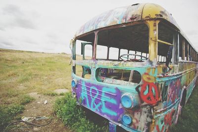 Abandoned boat against sky