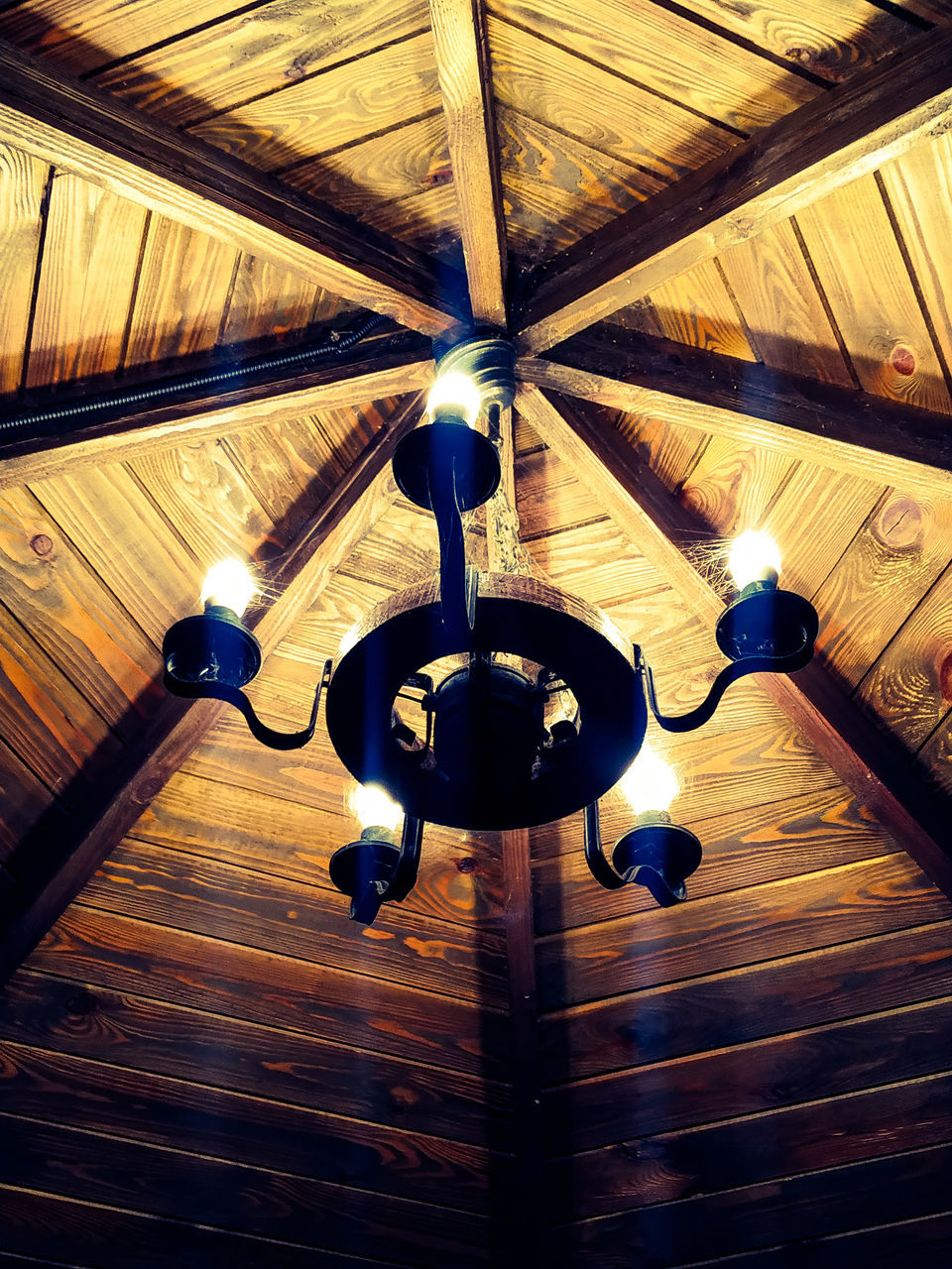 ceiling, low angle view, indoors, light, no people, lighting, wood, lighting equipment, architecture, hanging, built structure, illuminated