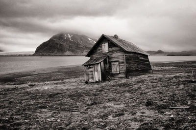 Abandoned shack at svalbard coast