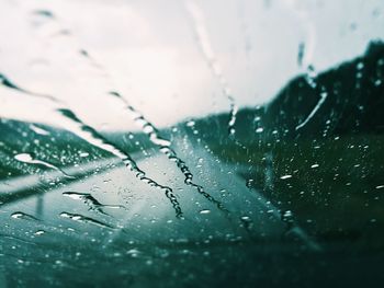 Close-up of rain drops on road