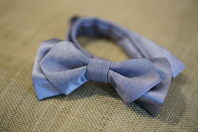 Close-up of bow tie on textile