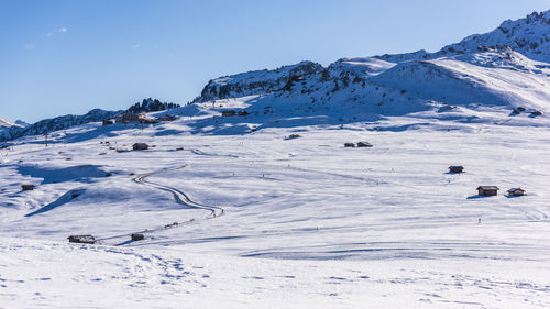 Scenic view of snowcapped mountains against clear sky