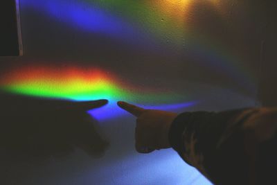 Low section of man on rainbow