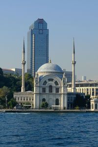 Low angle view of mosque against clear sky