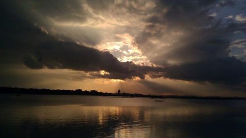 Scenic view of sea against cloudy sky