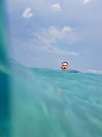 Portrait of man swimming in sea